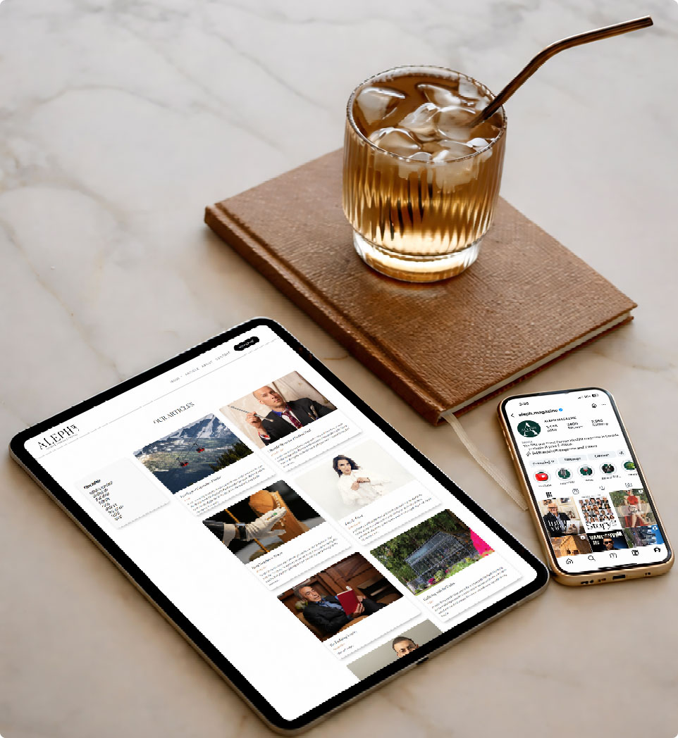 ALEPH digital edition on a tablet and phone beside a drink