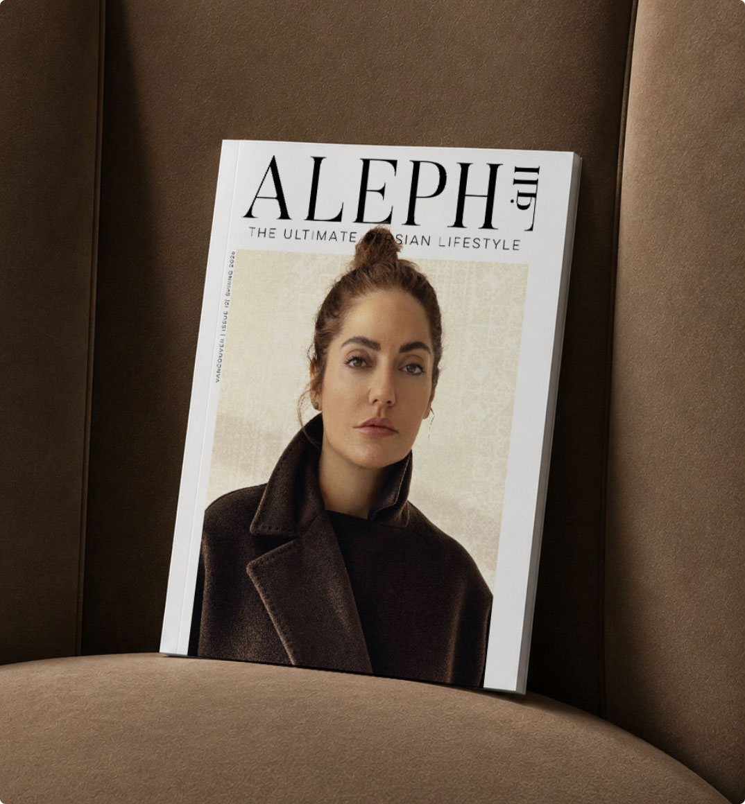 ALEPH Magazine cover resting on a velvet chair
