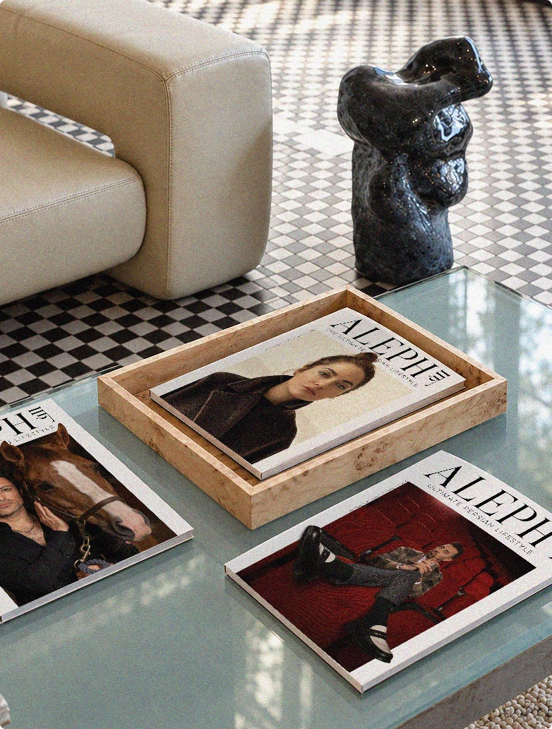 ALEPH Magazine issues on a coffee table