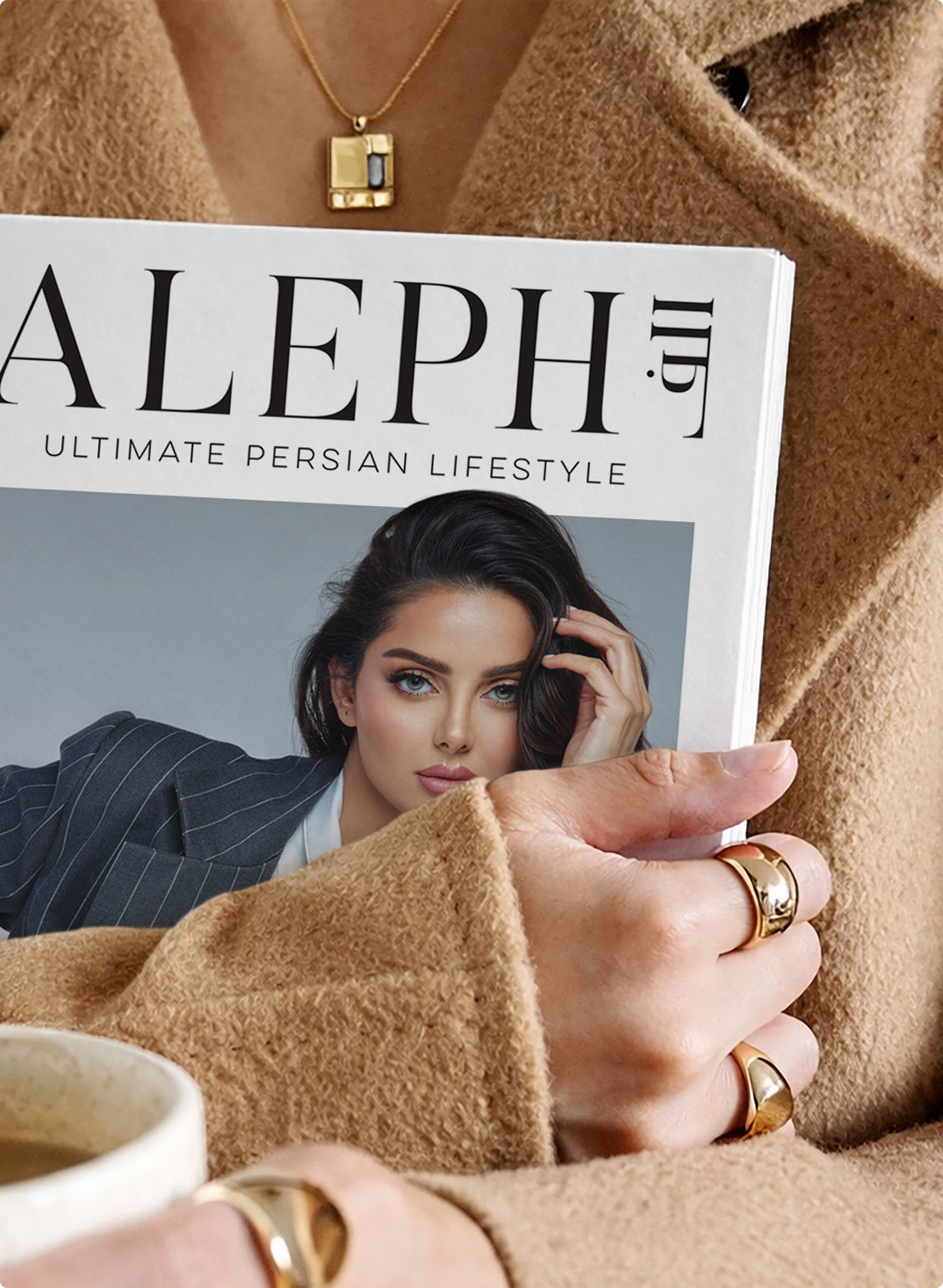 Woman in a camel coat holding an ALEPH Magazine cover